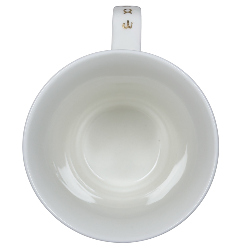 Interior view of a vintage Dunoon Leo Zodiac mug showcasing its smooth white ceramic design