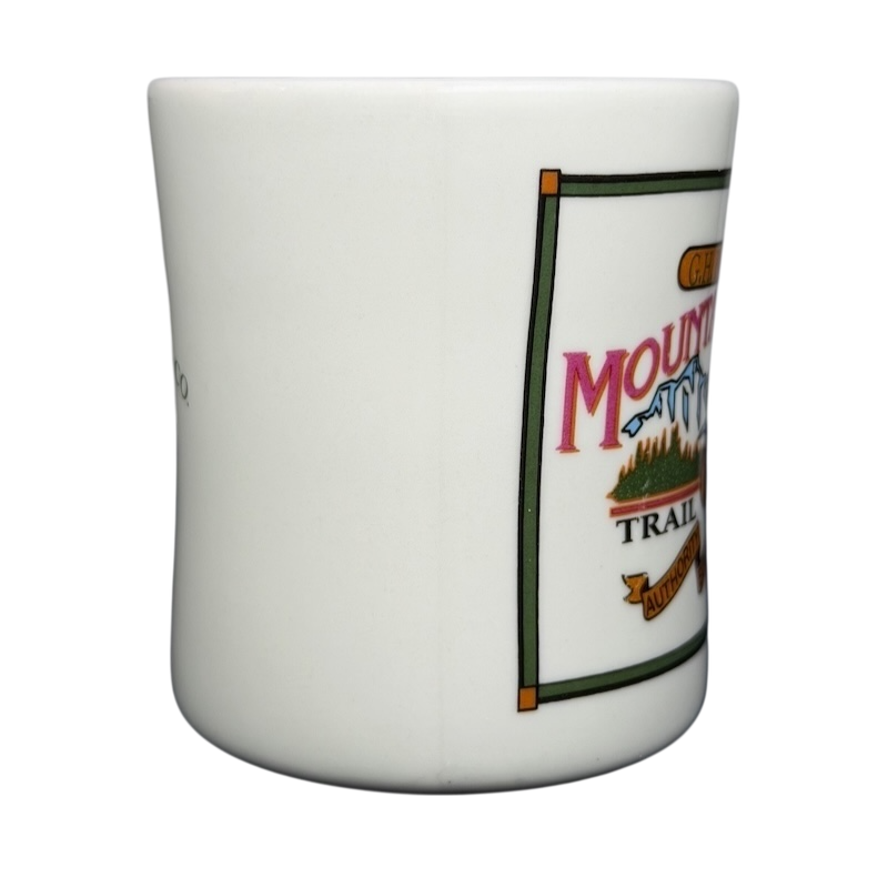 Vintage G.H. Bass mountain ridge mug featuring colorful graphics and a classic design.