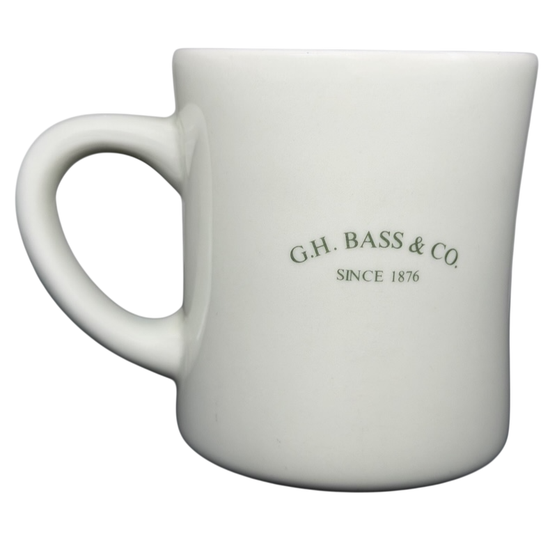 Vintage G.H. Bass mountain ridge mug in white ceramic with green text design