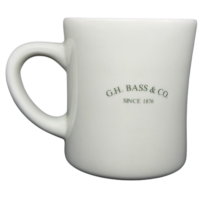 Vintage G.H. Bass mountain ridge mug in white ceramic with green text design