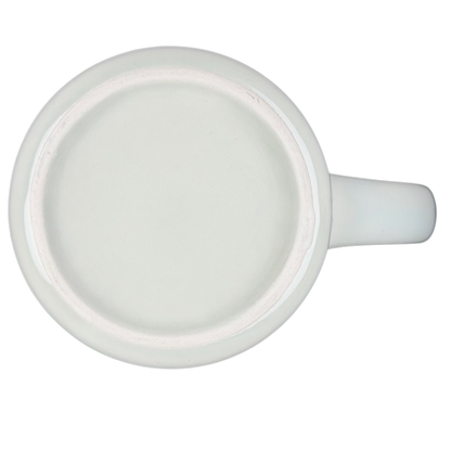 Bottom view of a vintage G.H. Bass canoe coffee mug showing smooth ceramic finish