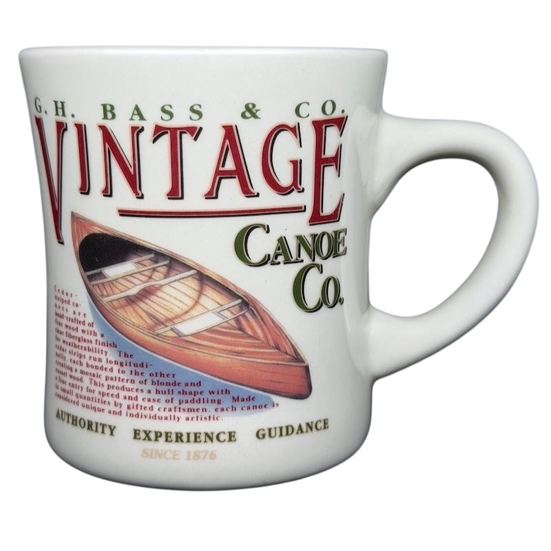 Vintage G.H. Bass canoe coffee mug featuring a classic canoe illustration and bold text design
