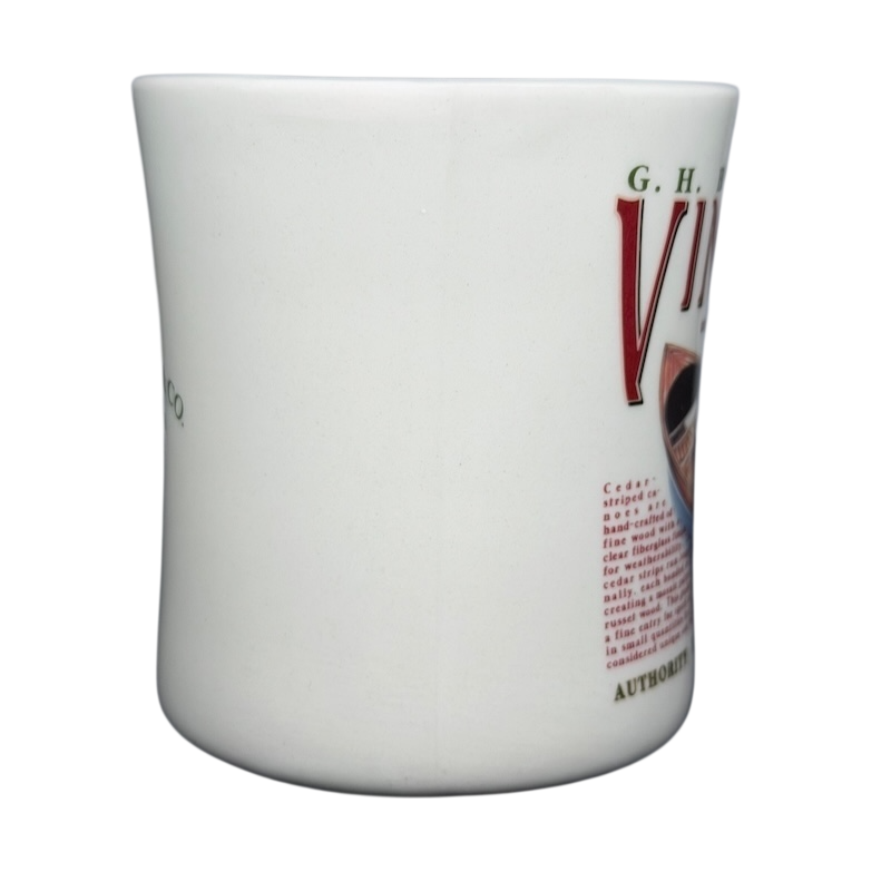 Vintage G.H. Bass canoe coffee mug featuring colorful graphic design and sturdy ceramic material.