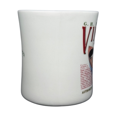 Vintage G.H. Bass canoe coffee mug featuring colorful graphic design and sturdy ceramic material.