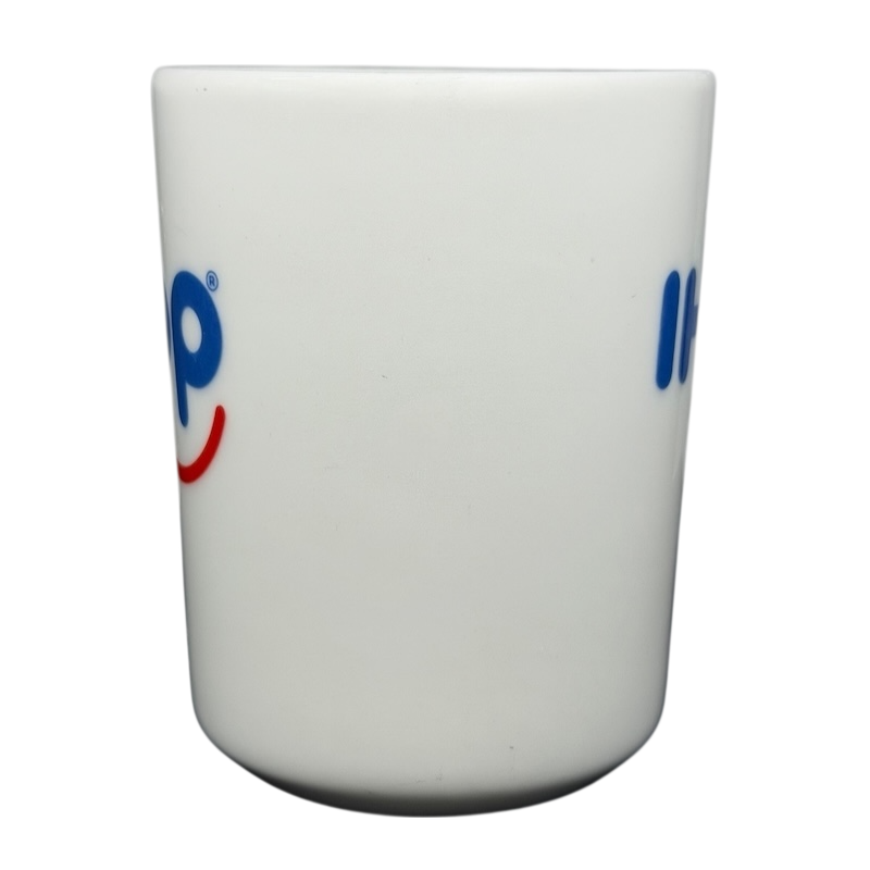 Vintage IHOP smiley mug with colorful logo design, perfect for coffee lovers and collectors