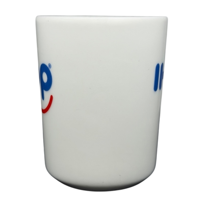 Vintage IHOP smiley mug with colorful logo design, perfect for coffee lovers and collectors