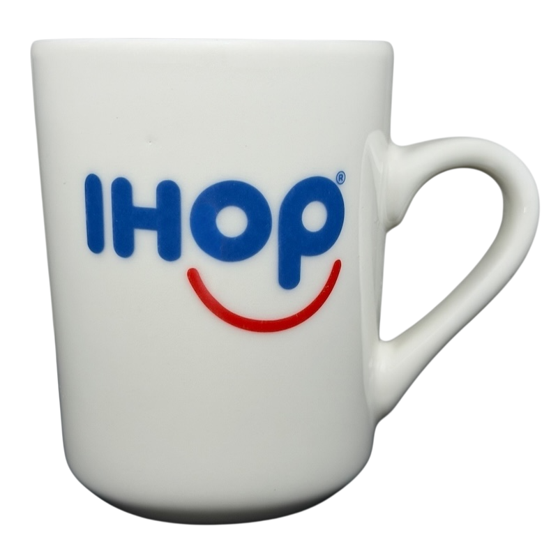 Vintage IHOP smiley mug in white with blue IHOP logo and smiling face design