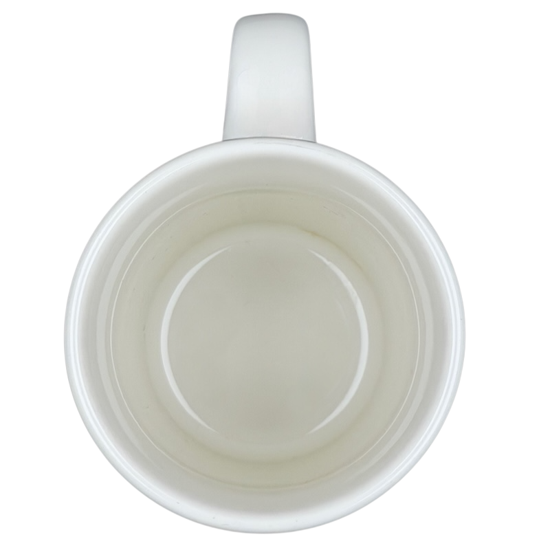 Top view of a vintage IHOP smiley mug featuring a simple white design for coffee lovers