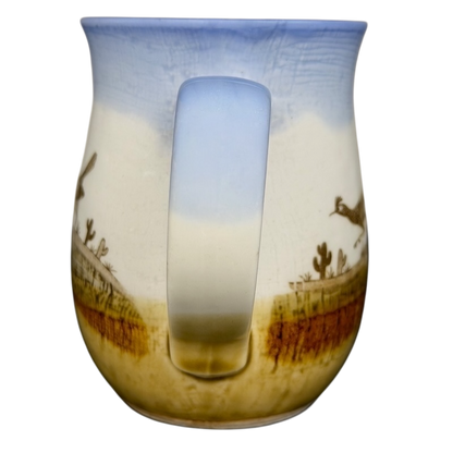 Vintage Otagiri roadrunner mug featuring a desert landscape with cacti and a blue sky