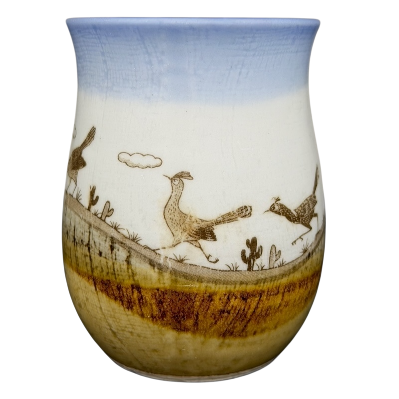 Vintage Otagiri roadrunner mug featuring playful designs of roadrunners and a desert landscape