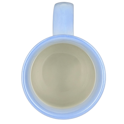 Top view of a vintage Otagiri roadrunner mug with a light blue handle and smooth interior