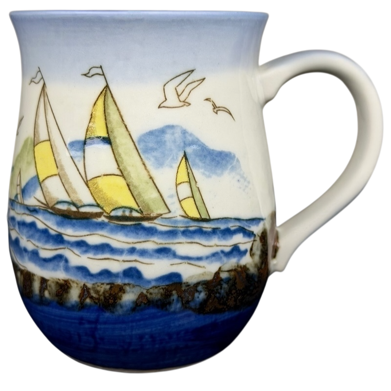 Vintage Otagiri sailboat mug featuring colorful sailboats on a blue ocean design