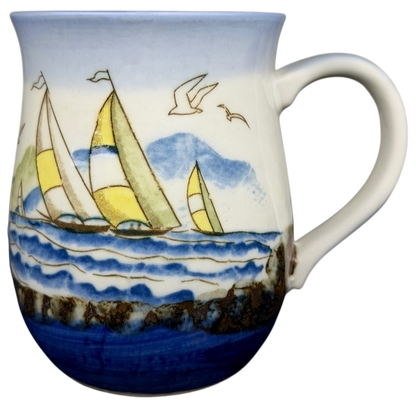 Vintage Otagiri sailboat mug featuring colorful sailboats on a blue ocean design