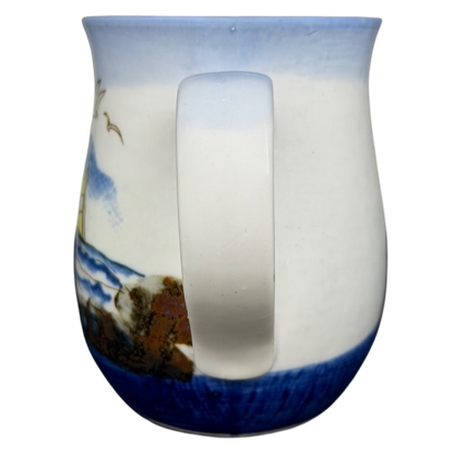 Vintage Otagiri sailboat mug featuring a scenic coastal design and a sturdy handle