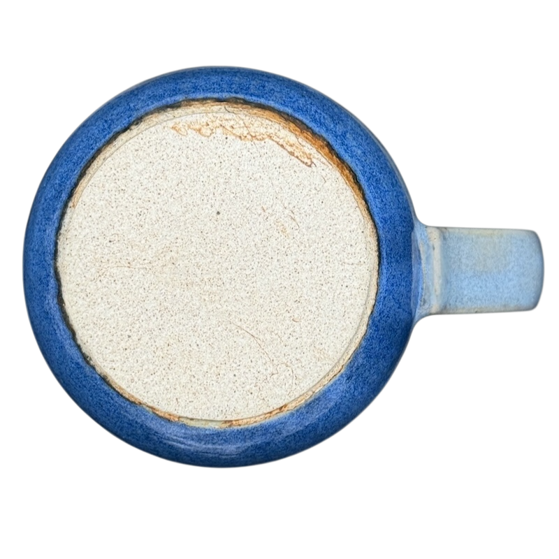 Bottom view of a vintage Otagiri trout tankard mug showcasing its blue color and ceramic texture