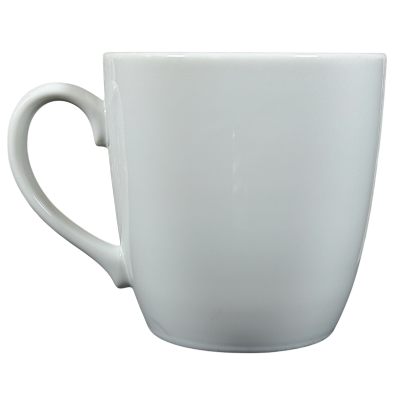 Plain white vintage Peet's Coffee mug gold frame with a classic curved handle on black background