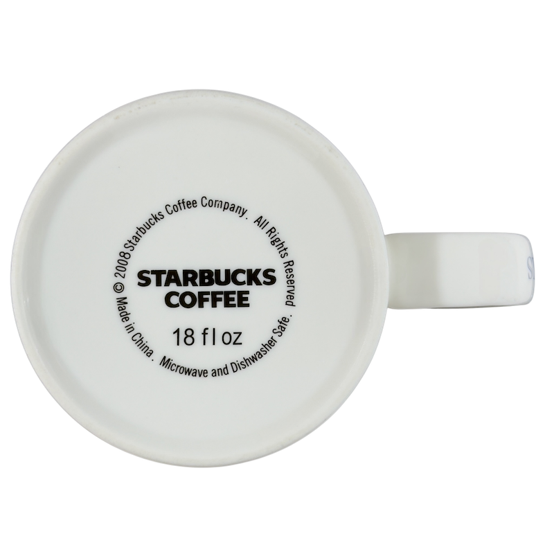 Bottom view of a vintage Pike Place Starbucks mug showcasing its 18 oz capacity and care instructions