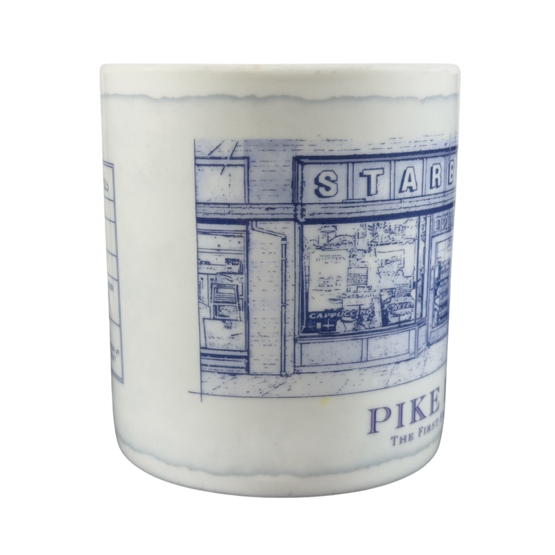 Vintage Pike Place Starbucks mug featuring an illustrated storefront design