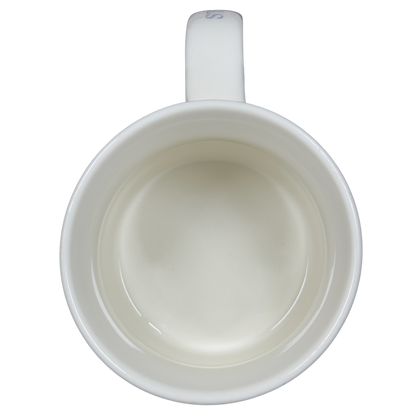 Interior view of a vintage Pike Place Starbucks mug showing a smooth white ceramic finish