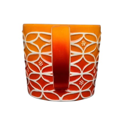 Vintage Starbucks abstract ombre mug with intricate pattern in warm orange and red tones