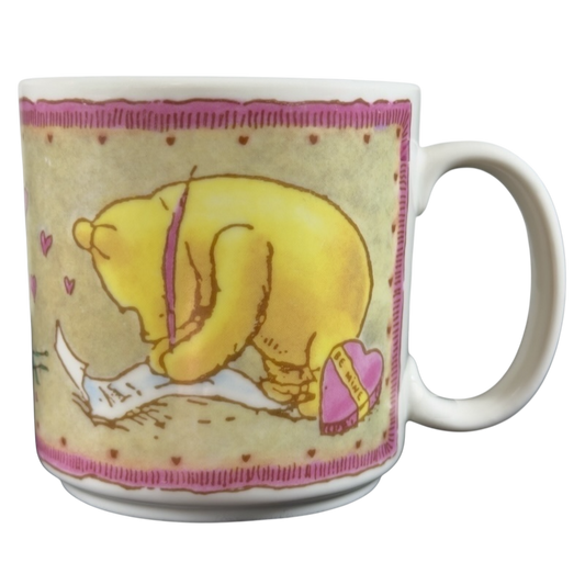Disney vintage Winnie the Pooh Love Letter mug featuring Pooh writing with a pink feather pen
