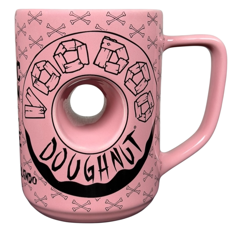 Voodoo Doughnut Universal Orlando mug featuring a pink doughnut design with cartoon-style graphics