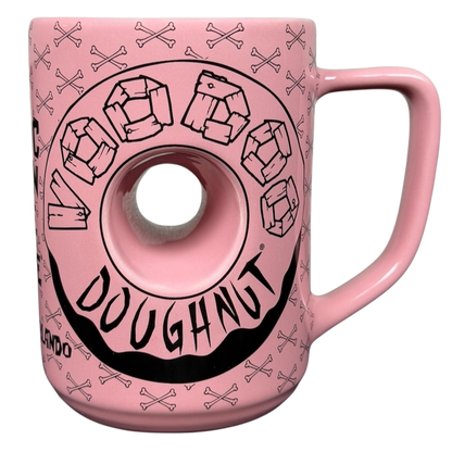Voodoo Doughnut Universal Orlando mug featuring a pink doughnut design with cartoon-style graphics