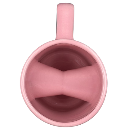 Voodoo Doughnut Universal Orlando mug in pink showcasing a smooth interior design