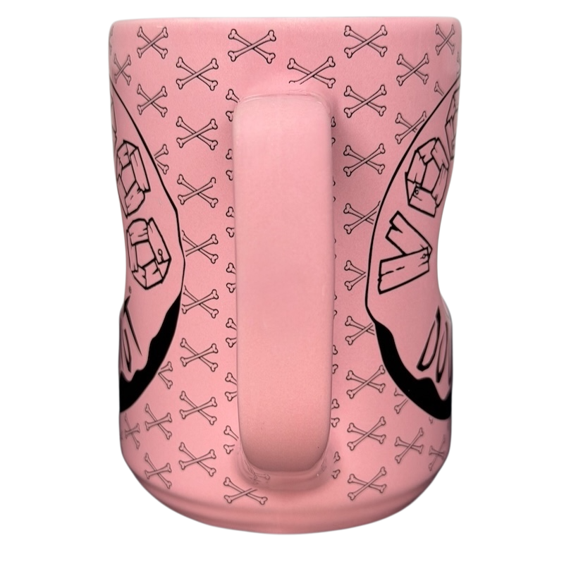 Voodoo Doughnut Universal Orlando mug in pink featuring classic logo and bone designs