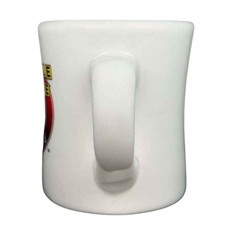 Side view of a Tuxton Waffle House vintage coffee mug with bold logo design