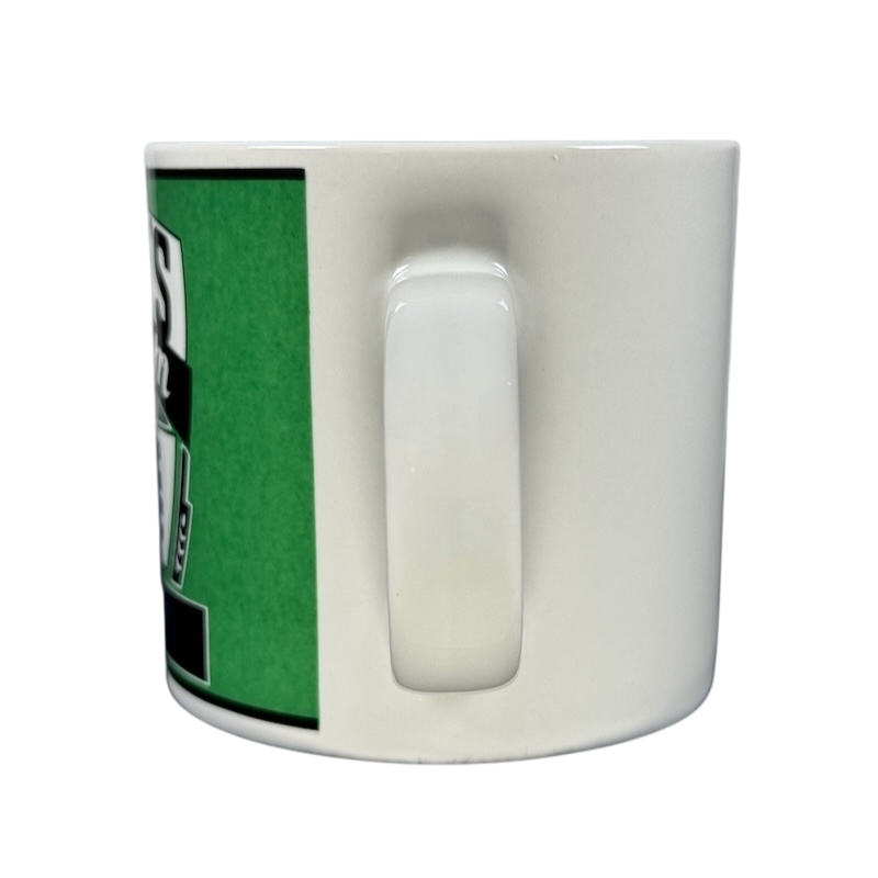 Side view of white ceramic mug with handle and green logo Kasper's Yester Year vintage coffee mug Westwood