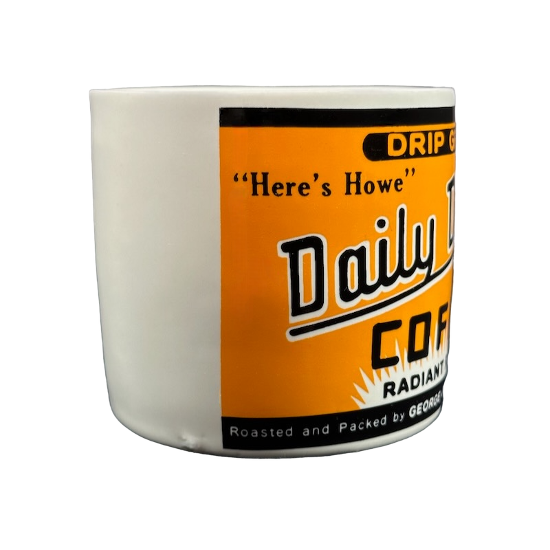 White ceramic mug with bright orange retro Daily Coffee label and black text Yester Year Daily Delight vintage coffee mug