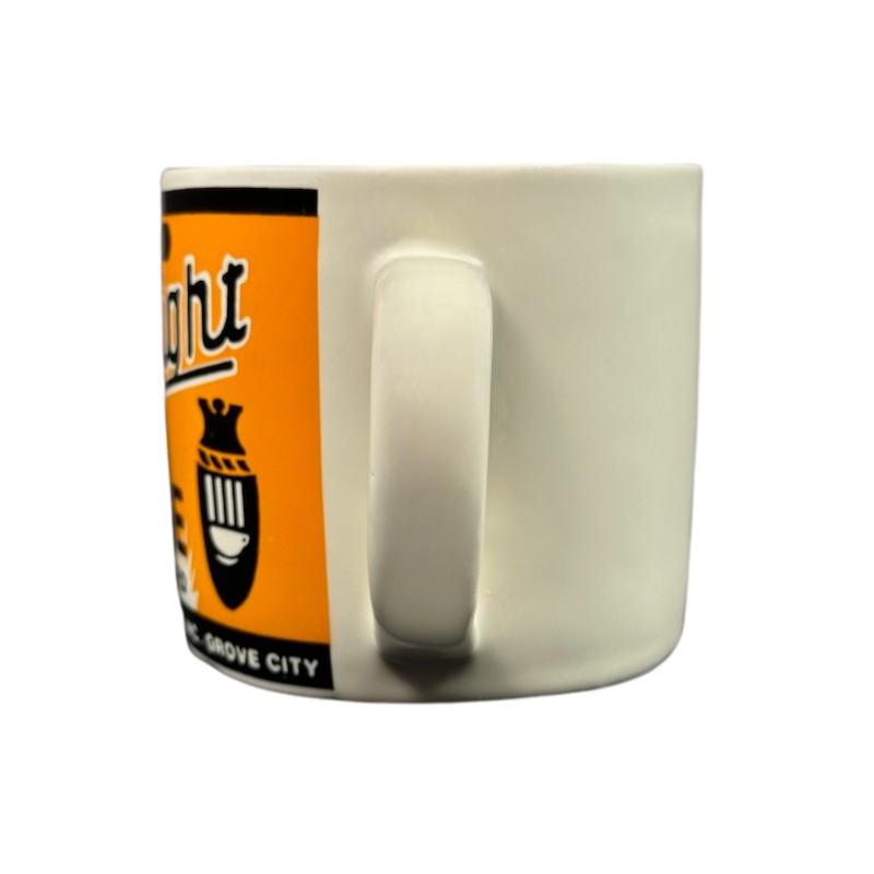 Side view of white ceramic mug with handle and orange retro label Yester Year Daily Delight vintage coffee mug for collectors