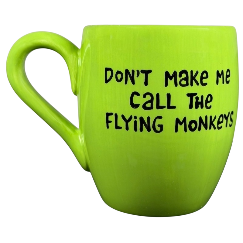 Vibrant green Wicked Wizard of Oz flying monkeys mug with playful text design