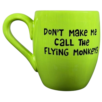 Vibrant green Wicked Wizard of Oz flying monkeys mug with playful text design