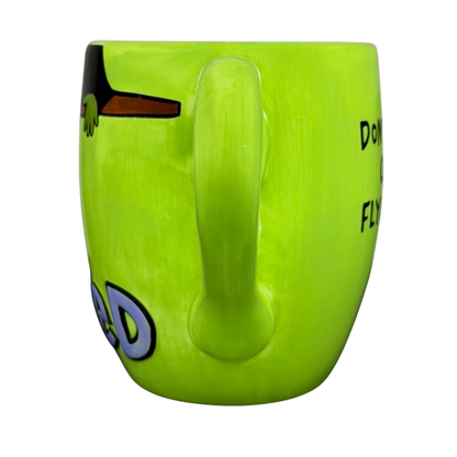 Wicked wizard of oz flying monkeys mug in vibrant green with whimsical designs and fun text
