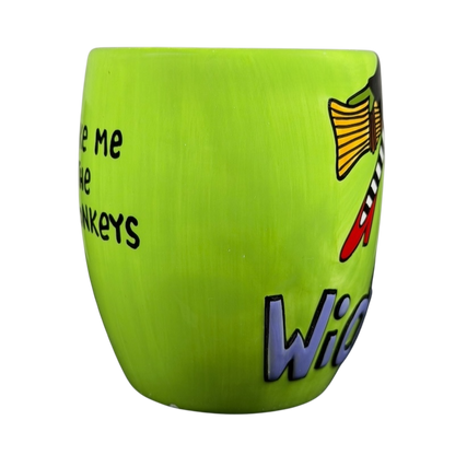 Wicked Wizard of Oz flying monkeys mug in vibrant green with playful design and text