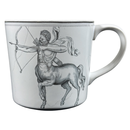 Williams Sonoma astrology mug featuring a detailed black and white illustration of the Sagittarius centaur with bow and arrow