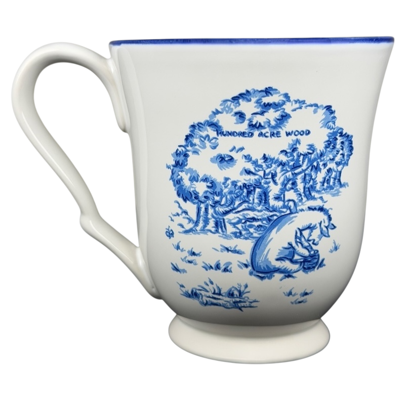 Disney Winnie the Pooh Eeyore footed collectible mug featuring scenic Hundred Acre Wood design
