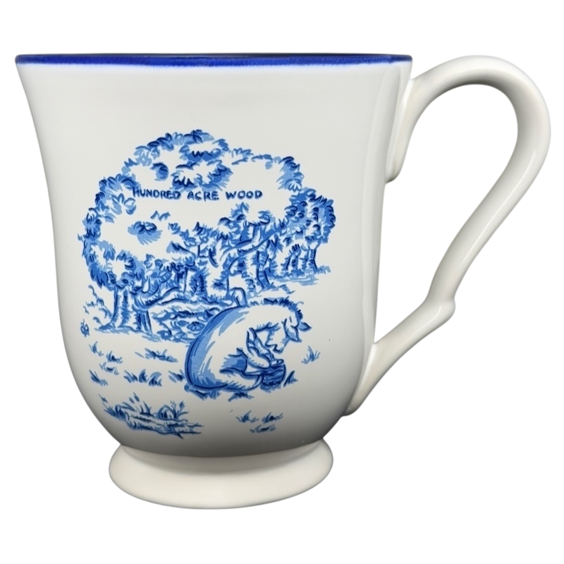 Winnie the Pooh Eeyore footed collectible mug featuring a blue design of the Hundred Acre Wood