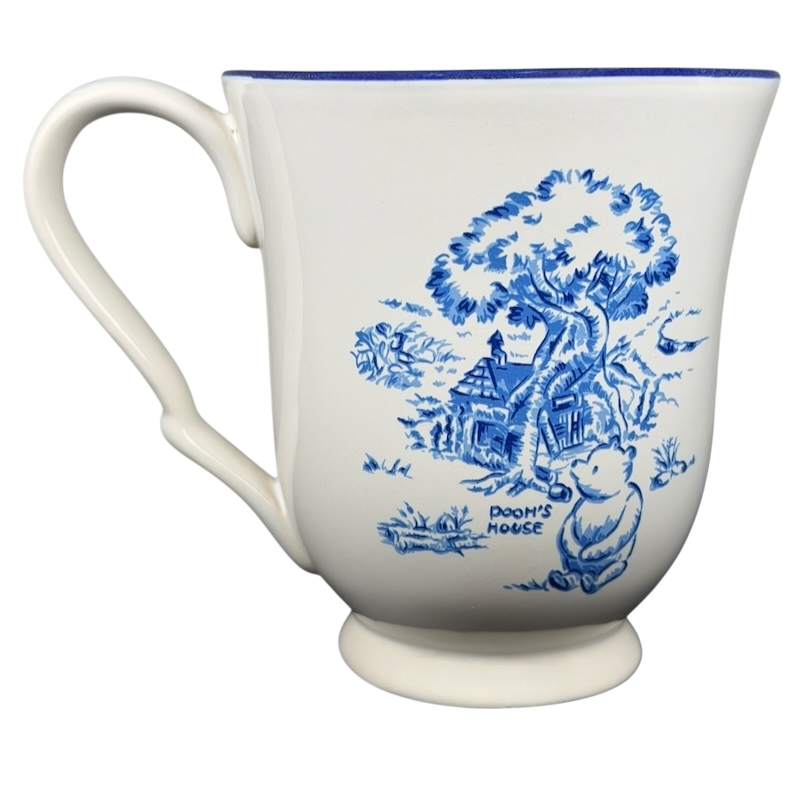 Disney Winnie the Pooh footed collectible mug featuring Pooh near his house in a charming blue design