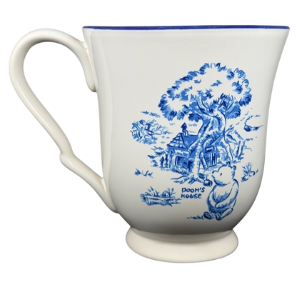 Disney Winnie the Pooh footed collectible mug featuring Pooh near his house in a charming blue design