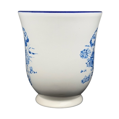 Winnie the Pooh footed collectible mug featuring blue floral designs on a white background