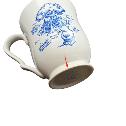 Winnie the Pooh footed collectible mug featuring Pooh by a tree with blue accents