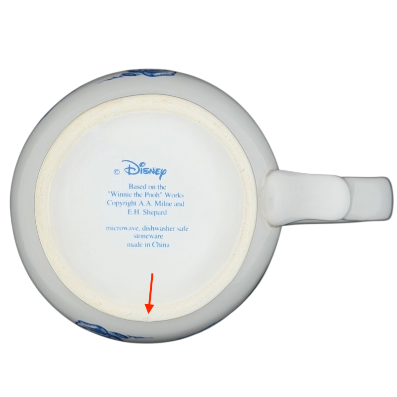 Winnie the Pooh footed collectible mug with detailed design and Disney branding