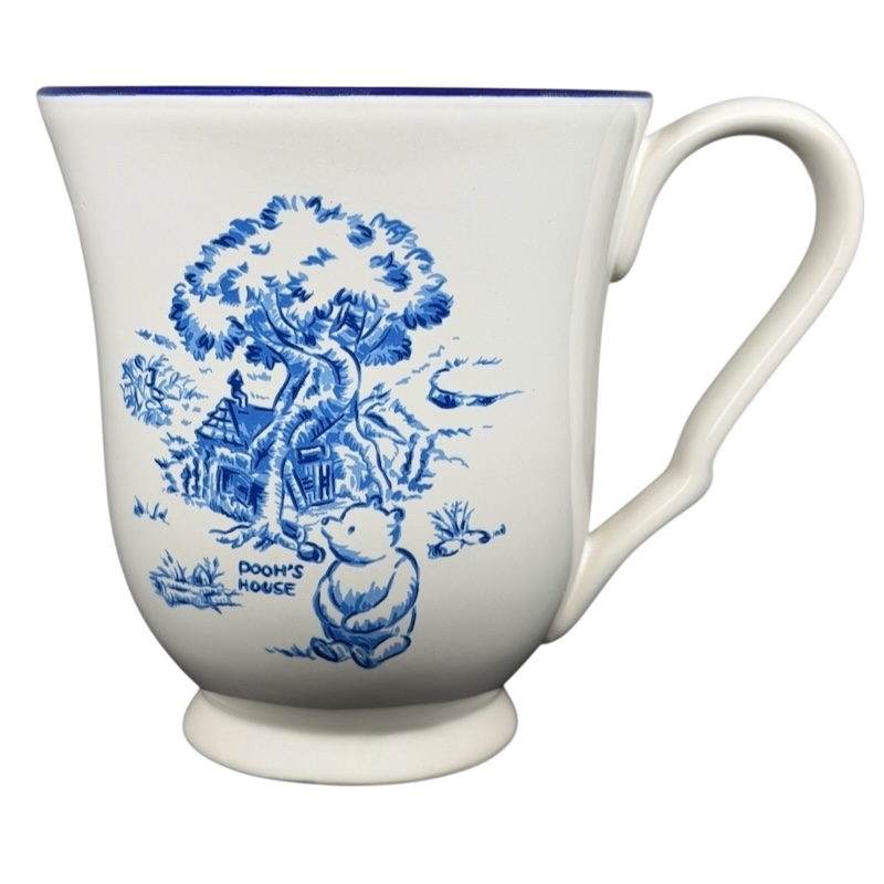 Winnie the Pooh footed collectible mug featuring Pooh and his house in blue design