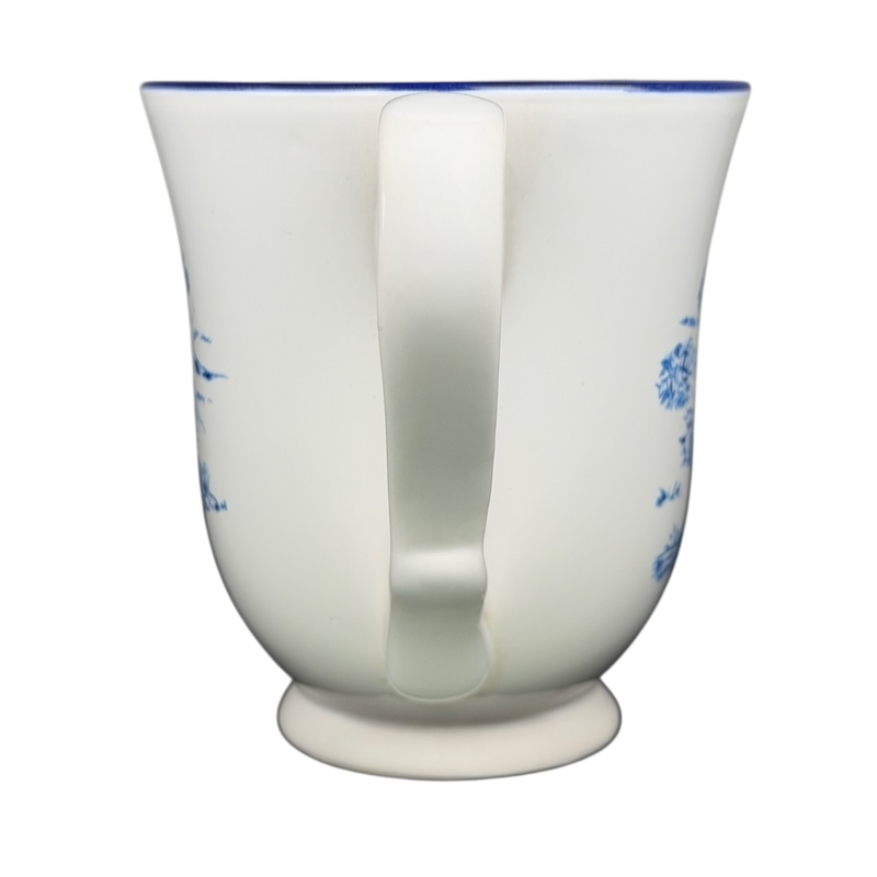 Disney Winnie the Pooh footed collectible mug featuring a charming blue floral design