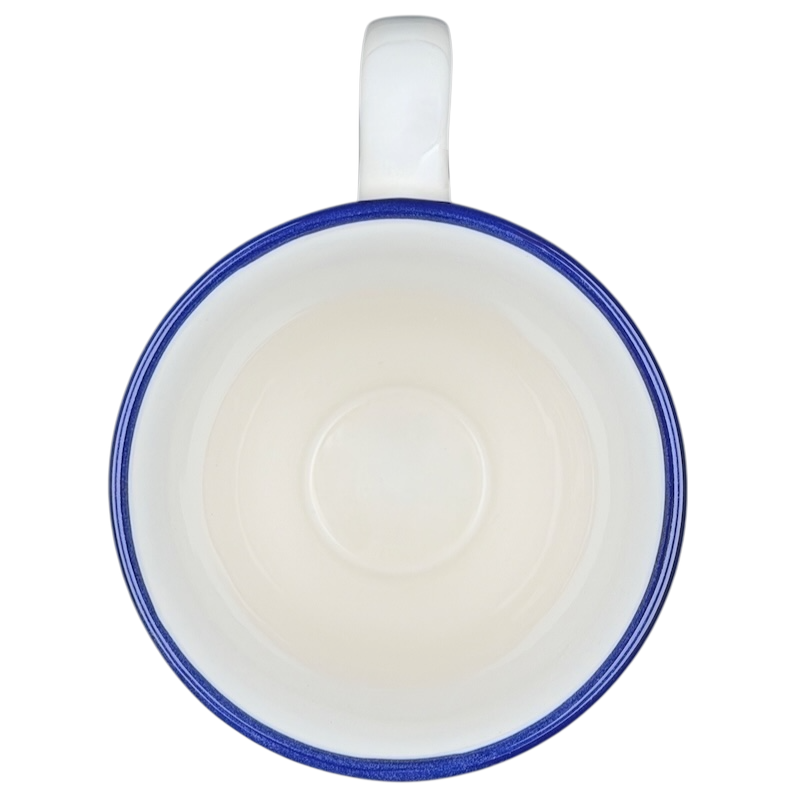 Top view of a Disney Winnie the Pooh footed collectible mug with a blue rim