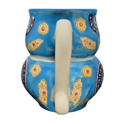 Yokohama Studios owl collectible mug featuring a vibrant blue design with floral patterns