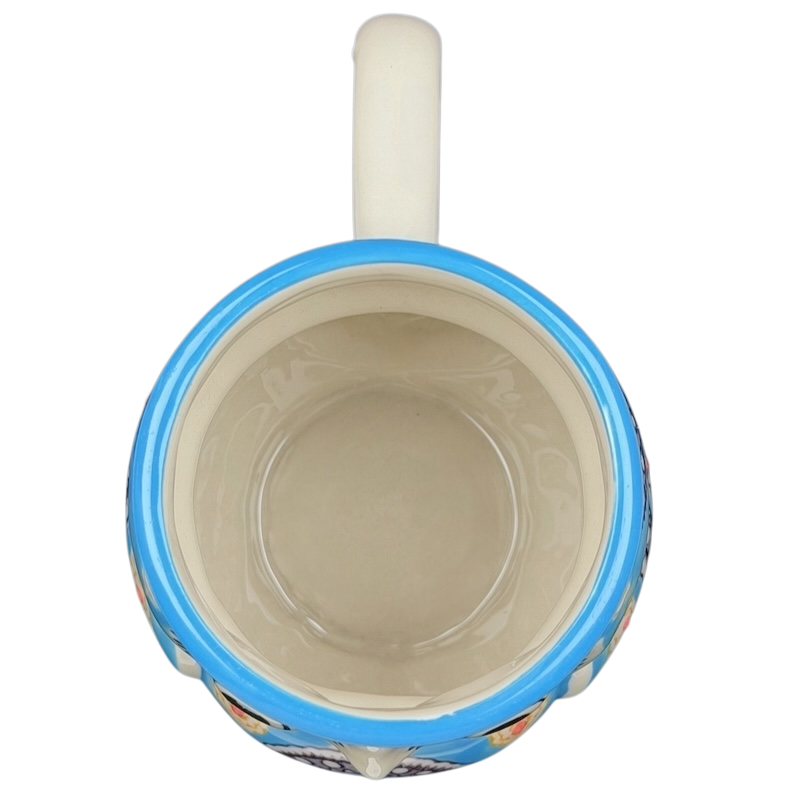 Inside view of Yokohama Studios owl collectible mug with a colorful design featuring owl motifs